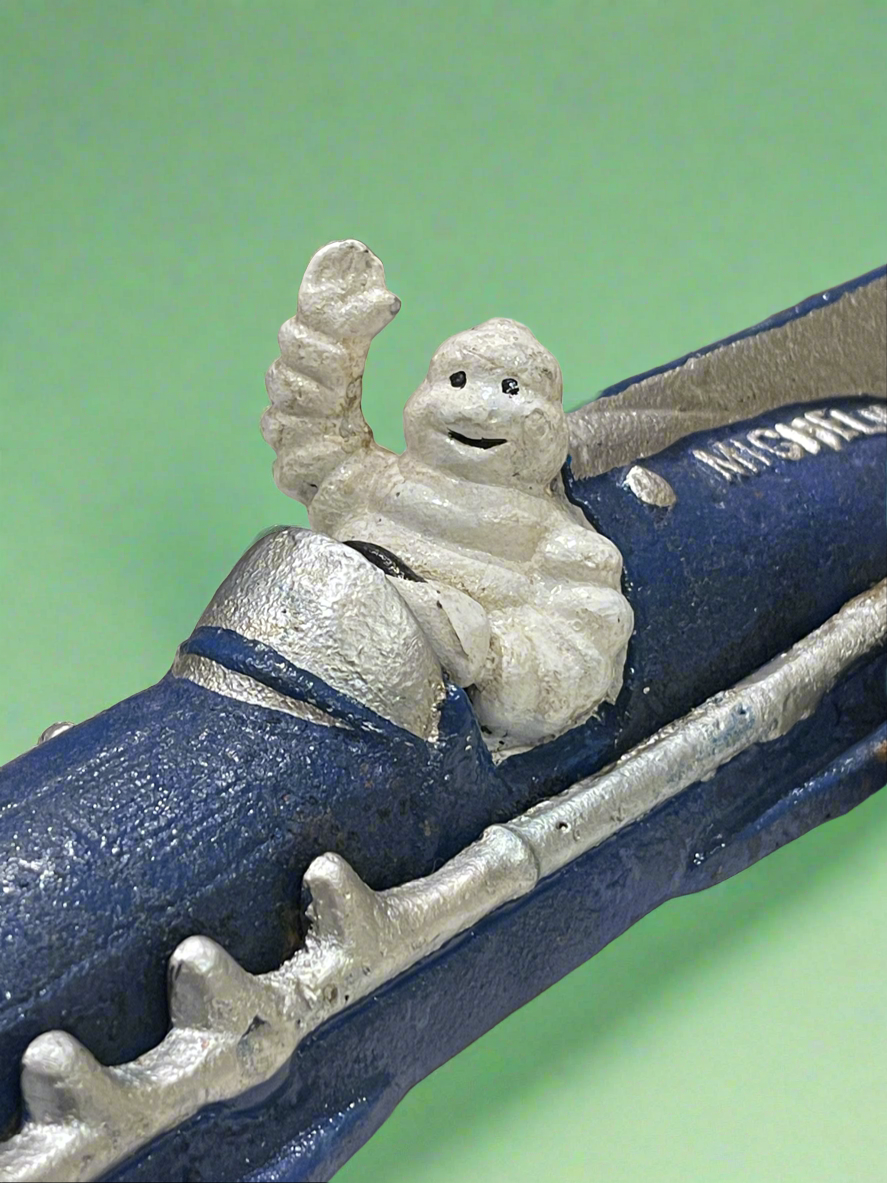 Cast Iron Michelin Man Racing Car Figure