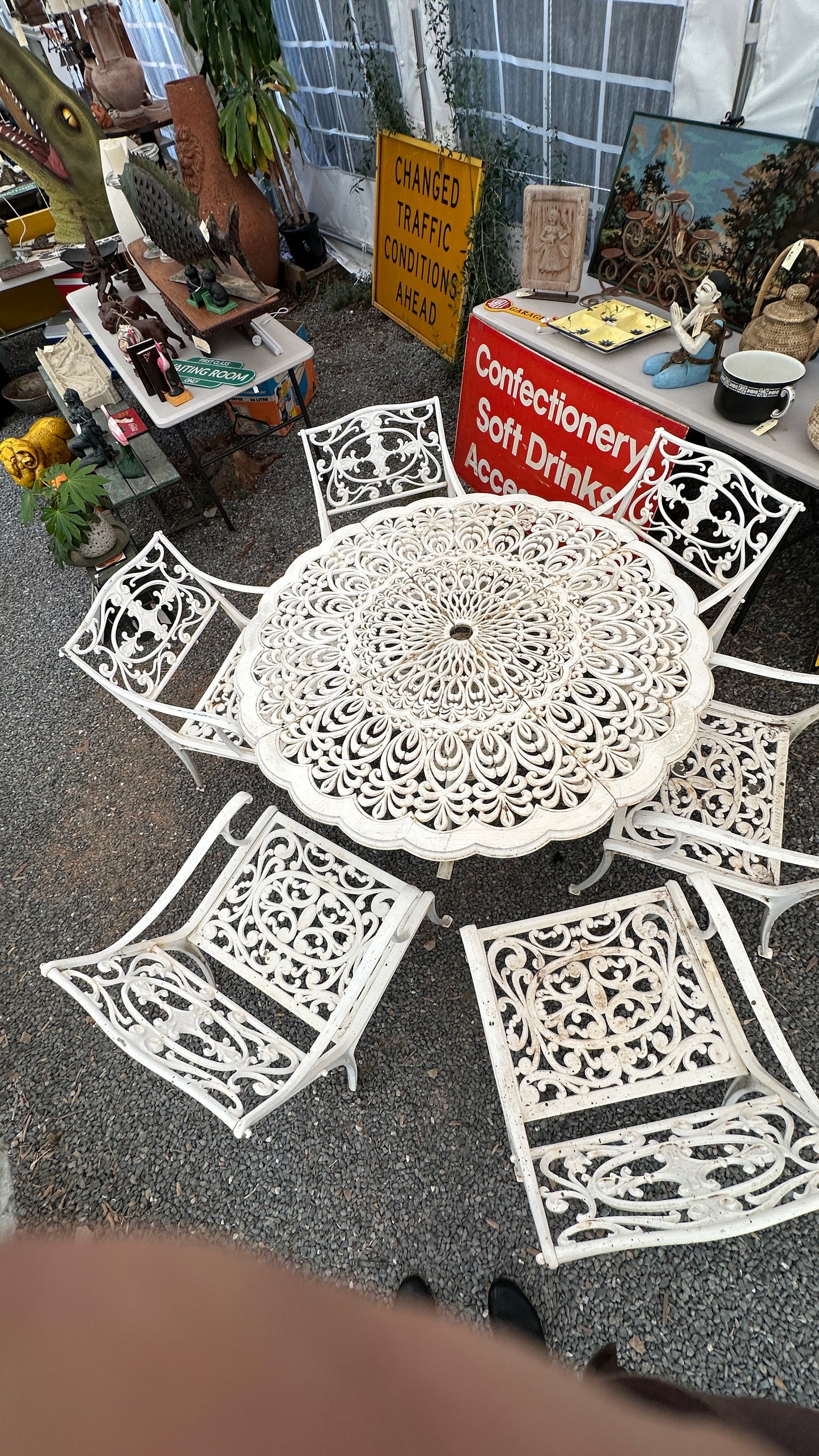 7-piece cast aluminum outdoor dining set with round table and 6 ornate chairs