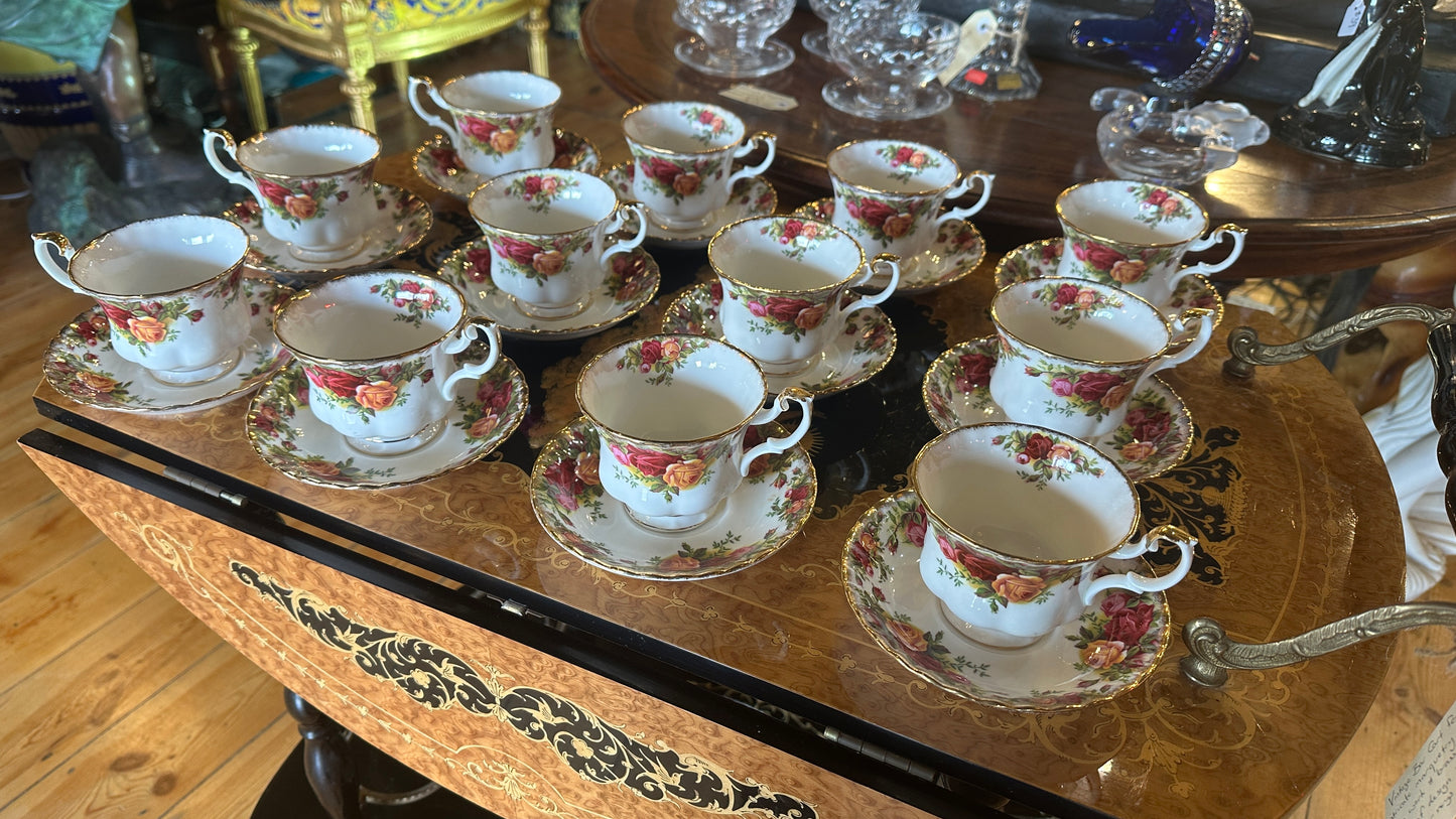 Teacup and saucer set in Prince Albert's “Old Country Roses” pattern trimmed in 22k gold