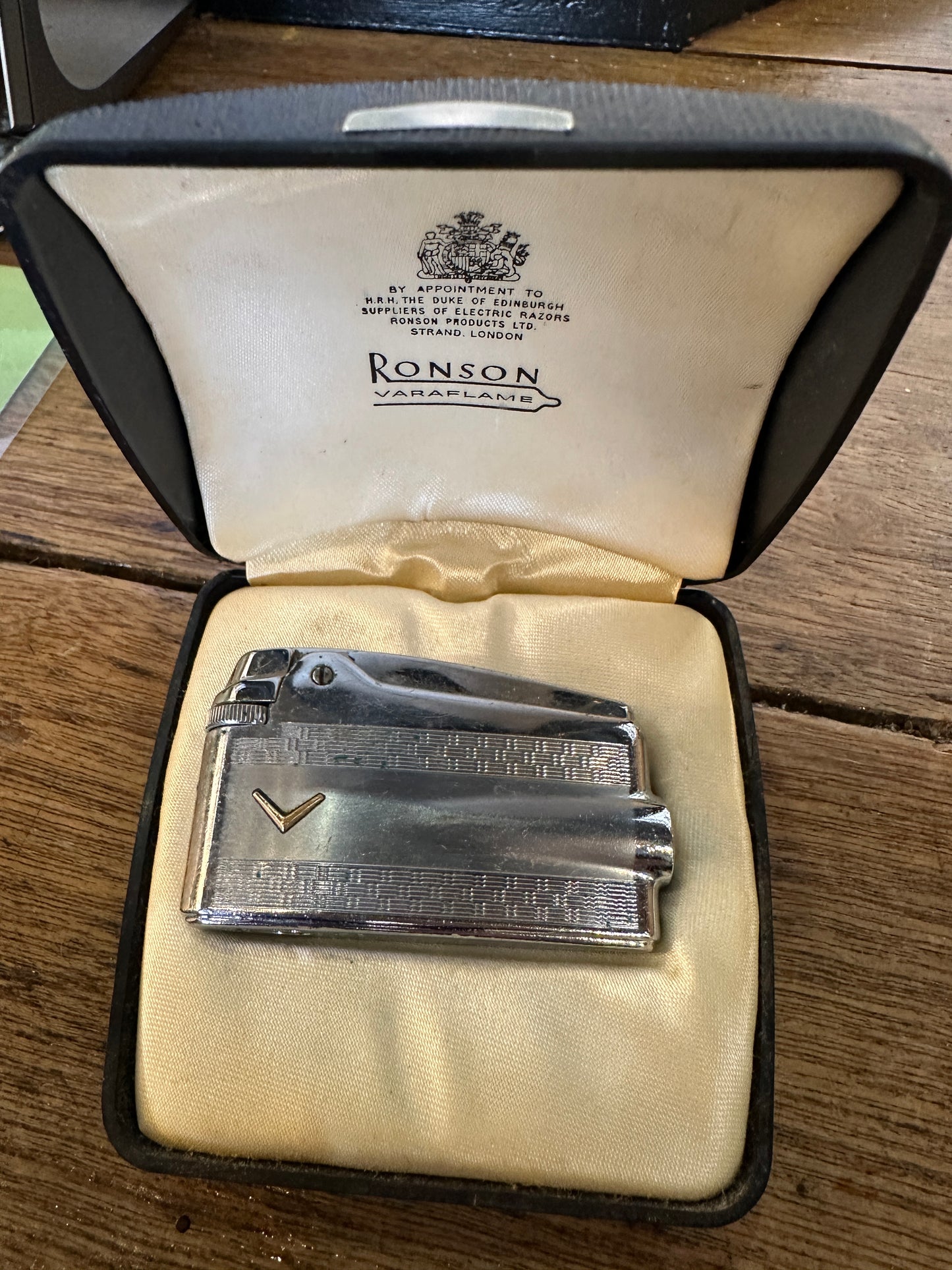 Vintage Ronson Varaflame butane lighter, displayed in its original presentation case.