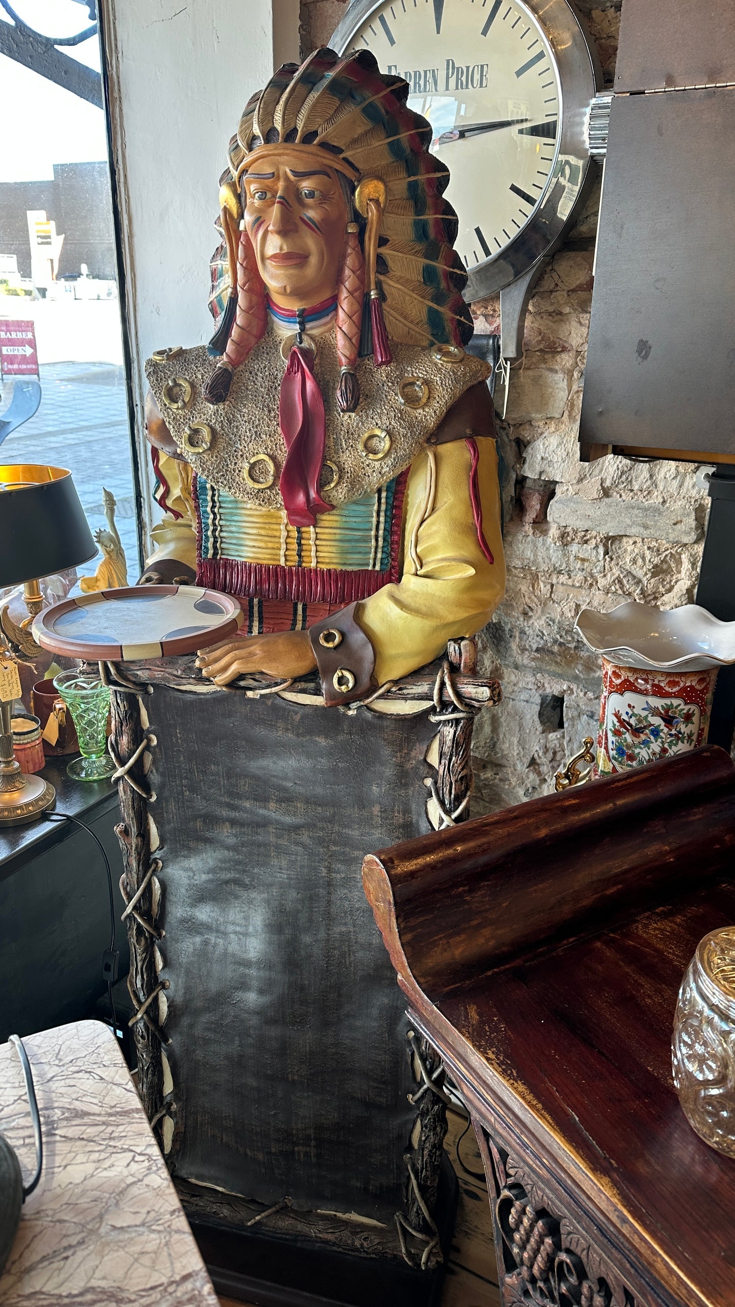 Life-size Native American Indian Chief fibreglass statue holding a tray and a menu board. Approx: 6” tall