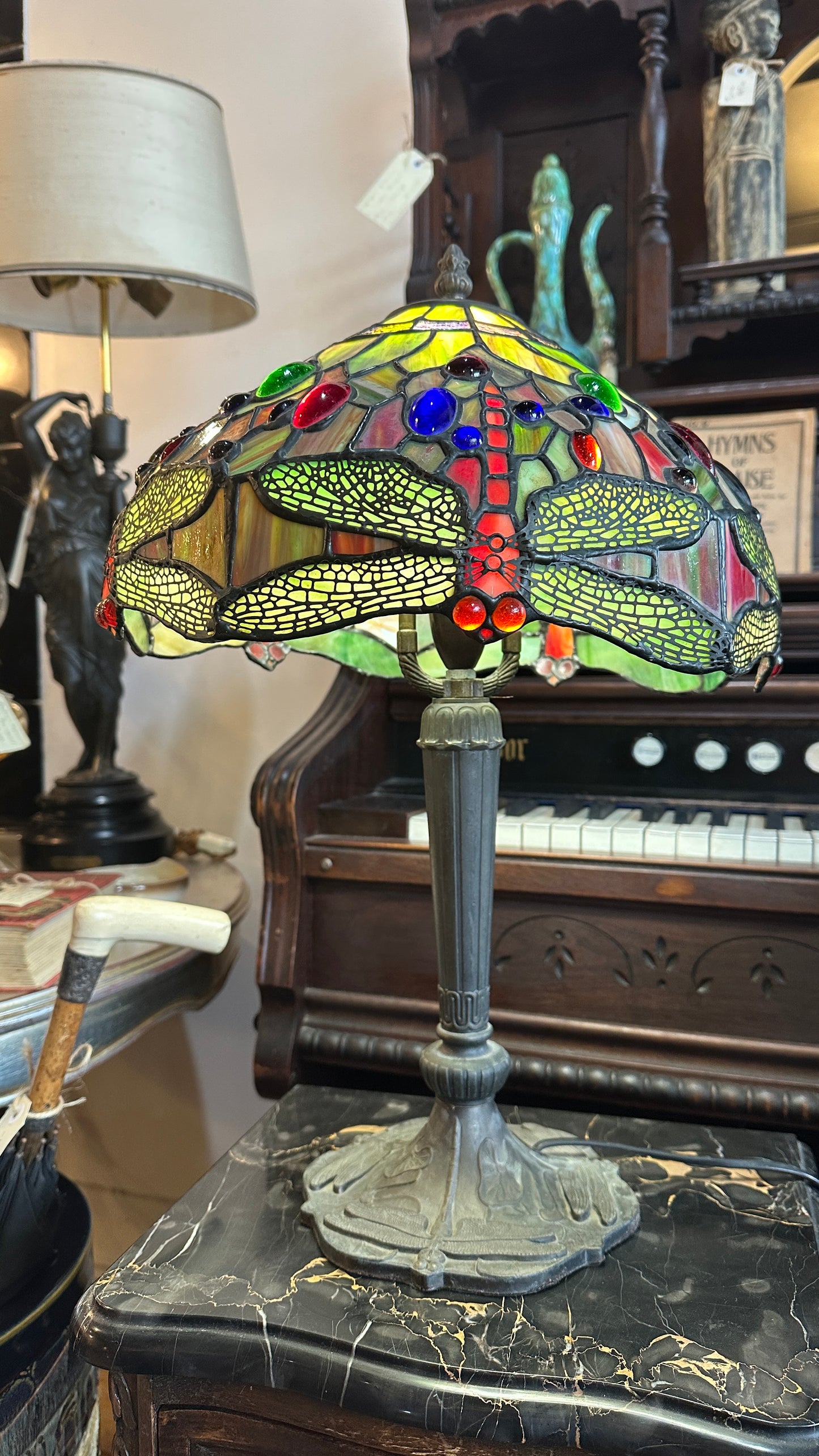 Tiffany-style Stained Glass Dragonfly table lamp with a bronze-colored base.