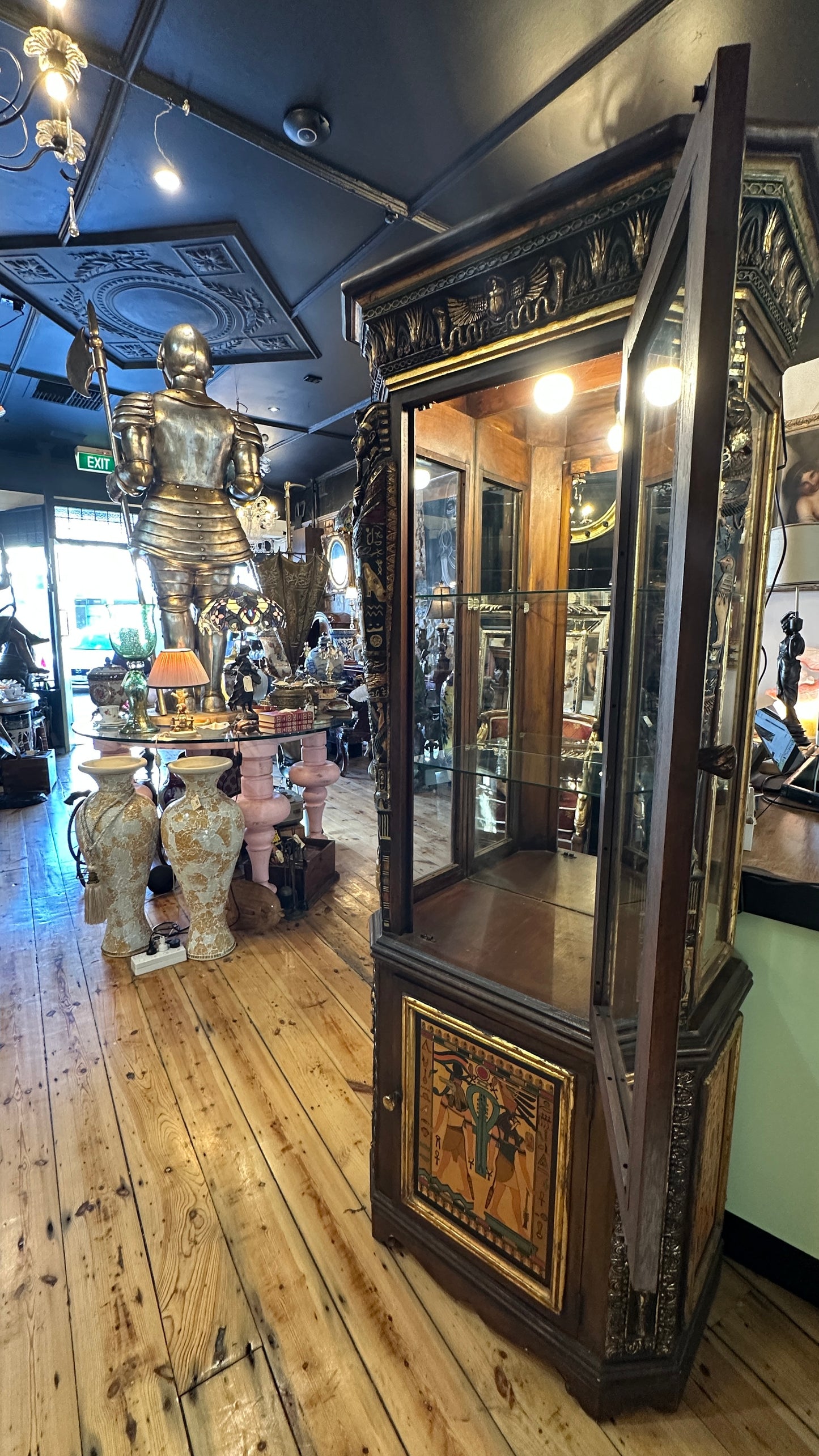 Egyptian Sarcophagus style display cabinet, with glass shelves and interior lighting