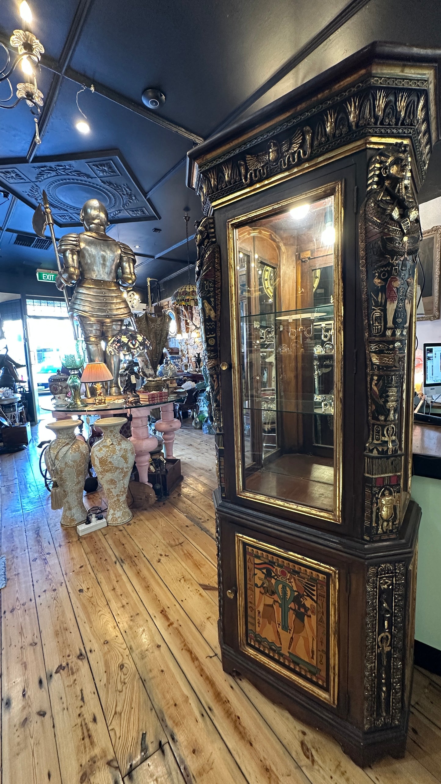 Egyptian Sarcophagus style display cabinet, with glass shelves and interior lighting