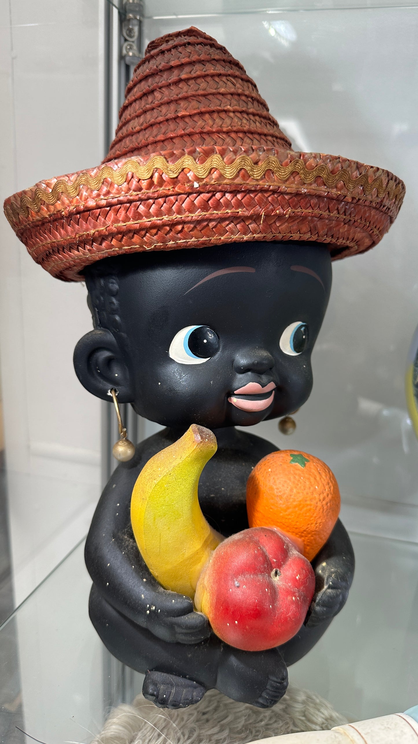 Vintage large ceramic bobblehead coin bank child holding fruit and wearing a straw hat