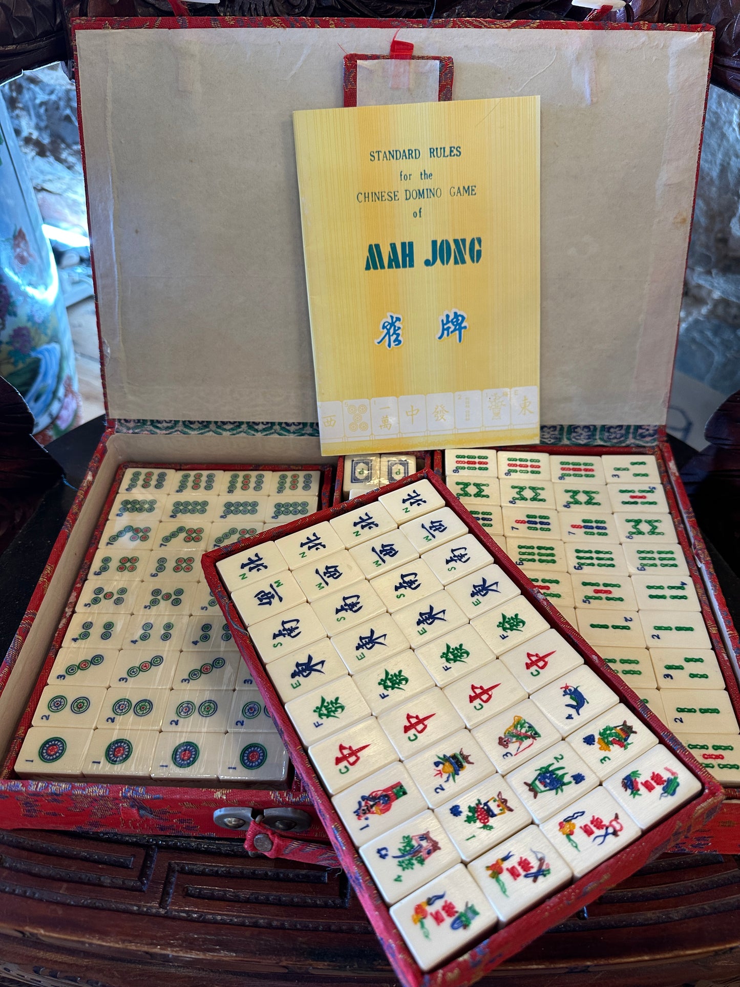 Vintage Mahjong set, including red brocade silk case and "Standard Rules" booklet