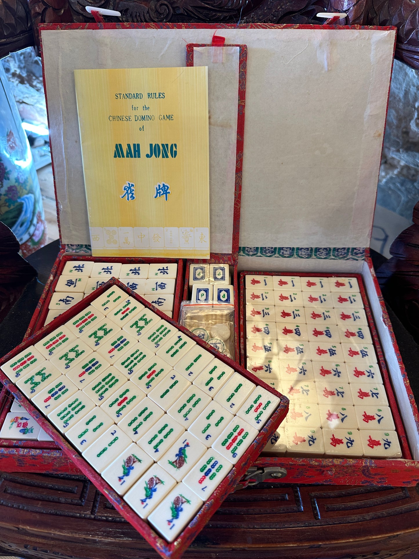 Vintage Mahjong set, including red brocade silk case and "Standard Rules" booklet