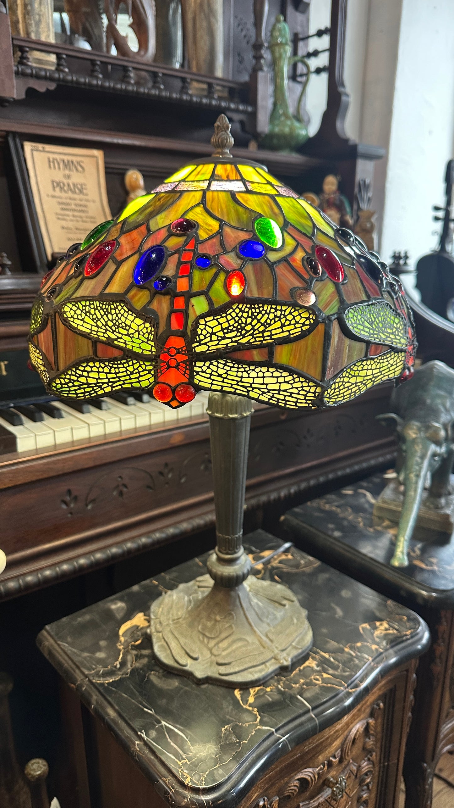 Tiffany-style Stained Glass Dragonfly table lamp with a bronze-colored base.