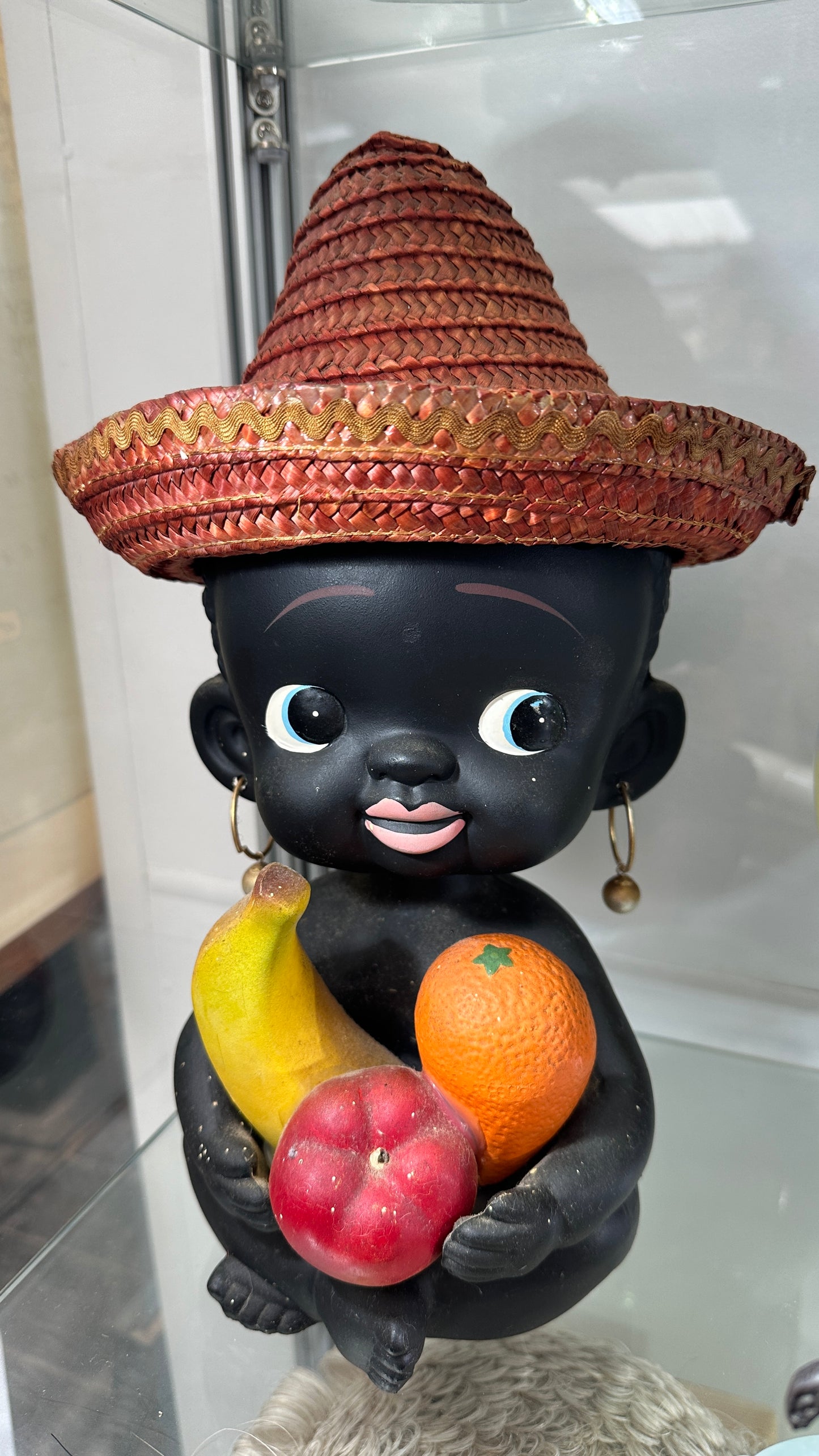 Vintage large ceramic bobblehead coin bank child holding fruit and wearing a straw hat