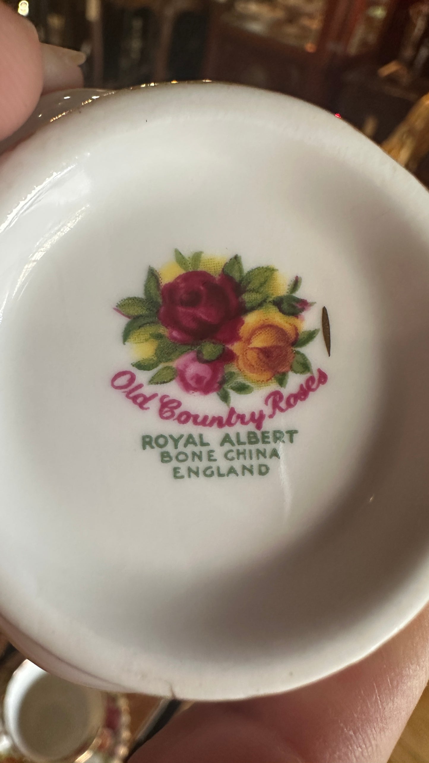 Teacup and saucer set in Prince Albert's “Old Country Roses” pattern trimmed in 22k gold