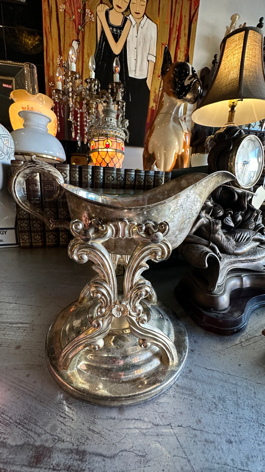 Vintage silver-plated tilting gravy boat with elaborate matching stand