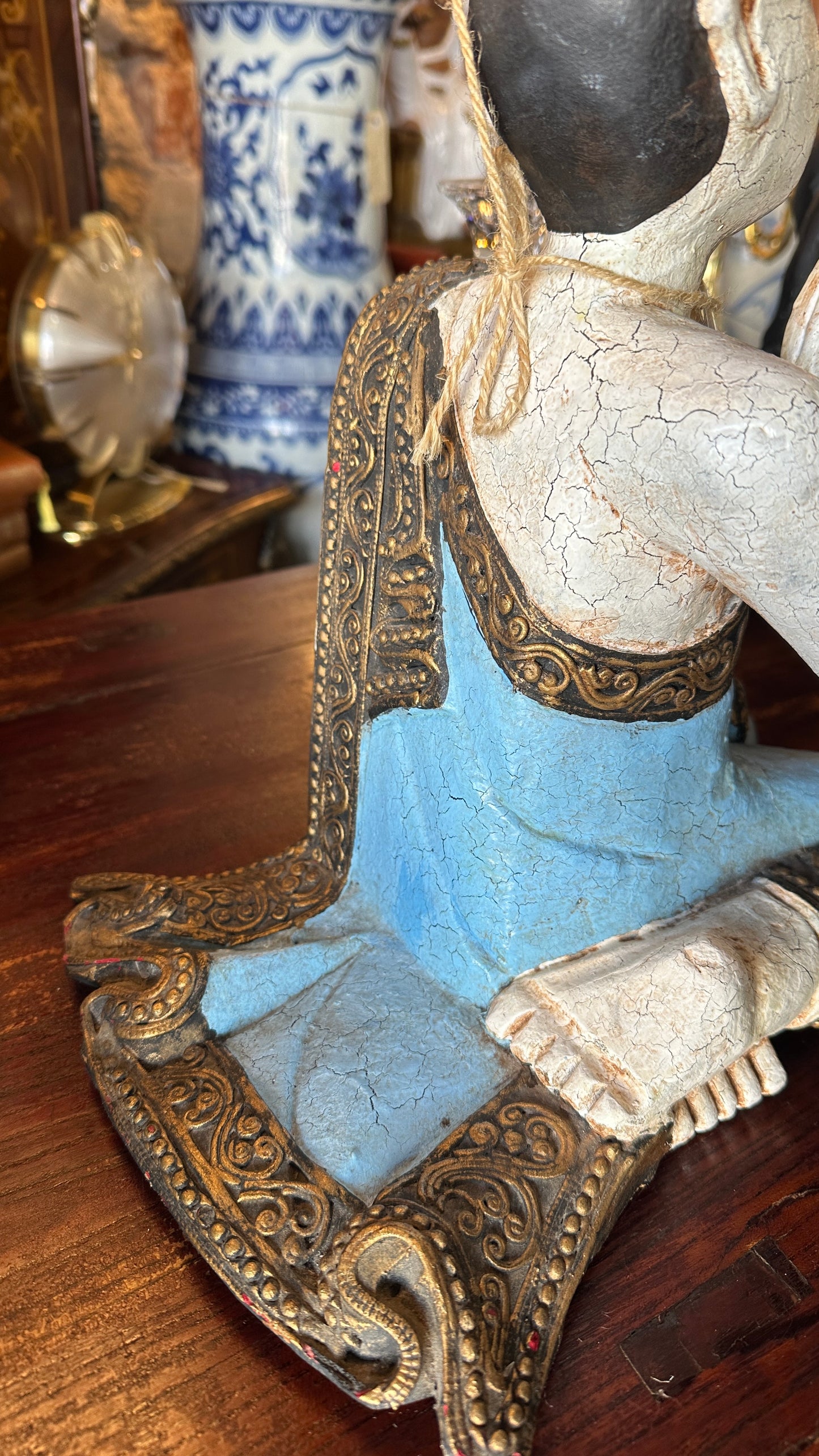 Vintage carved wooden sculpture of a praying monk