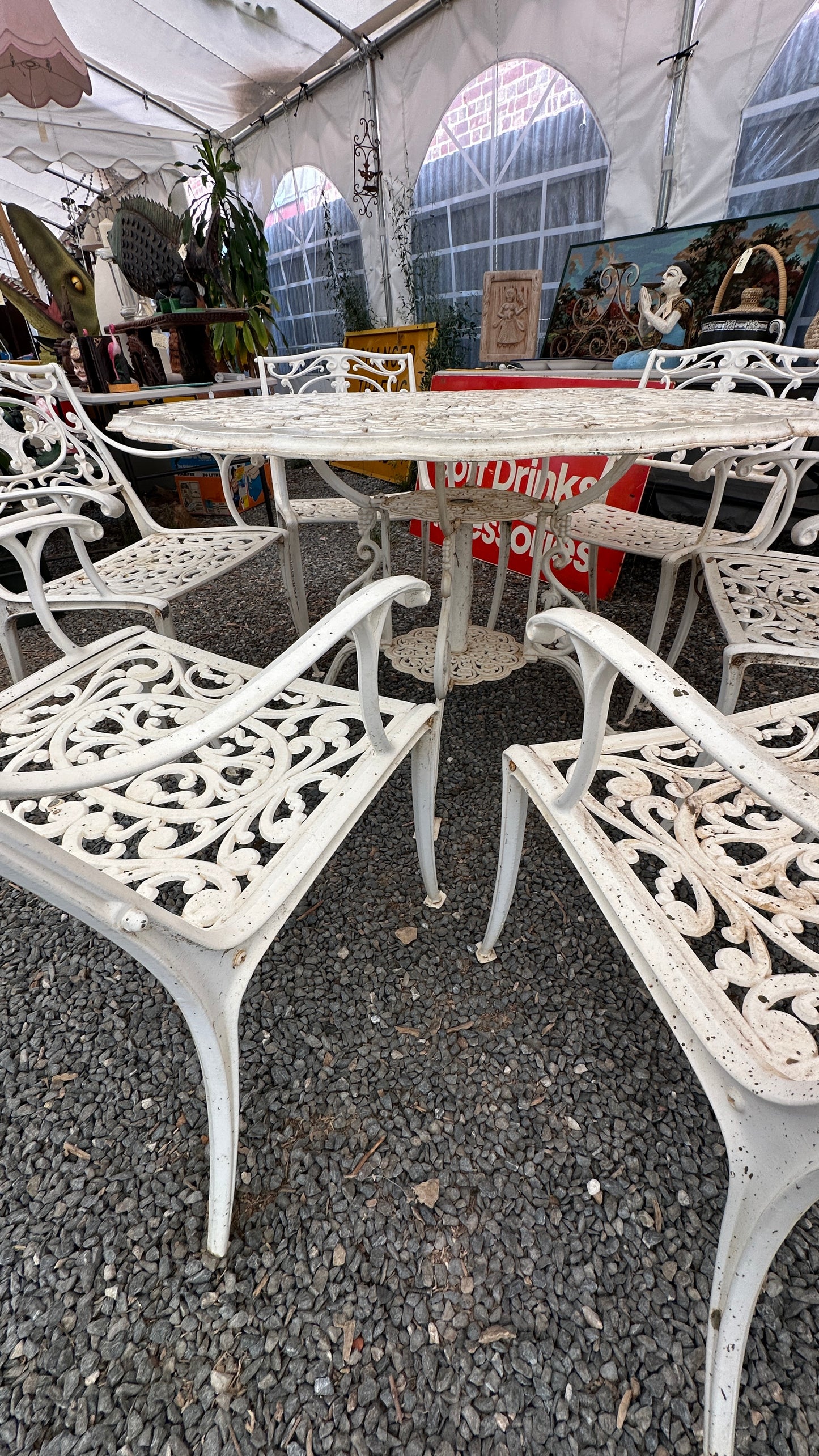 7-piece cast aluminum outdoor dining set with round table and 6 ornate chairs