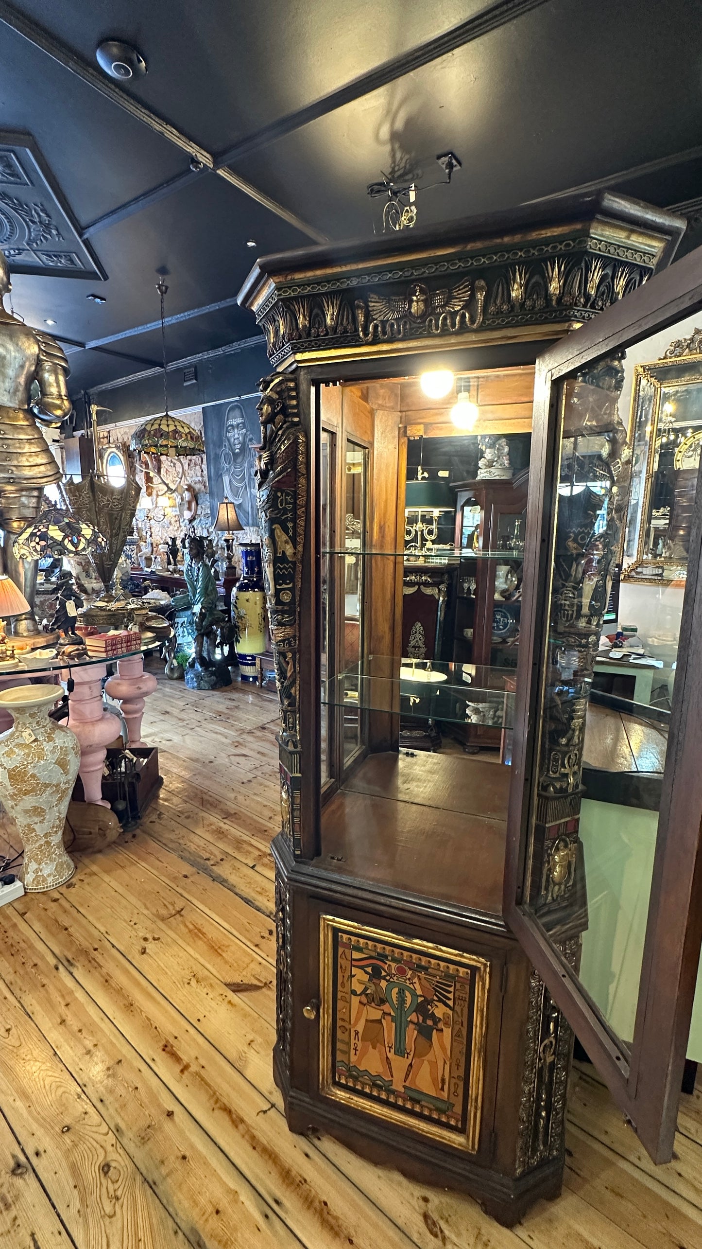 Egyptian Sarcophagus style display cabinet, with glass shelves and interior lighting