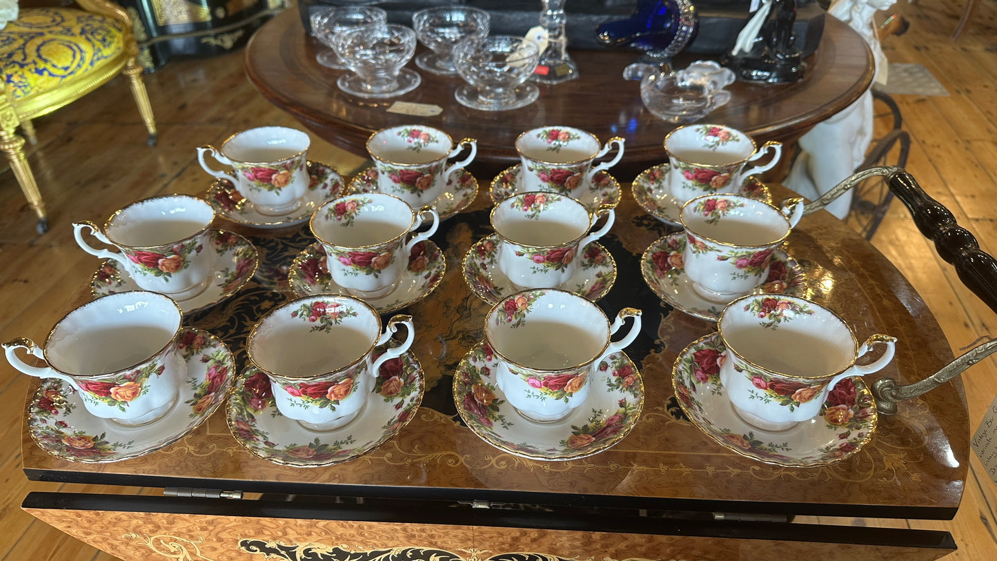 Teacup and saucer set in Prince Albert's “Old Country Roses” pattern trimmed in 22k gold