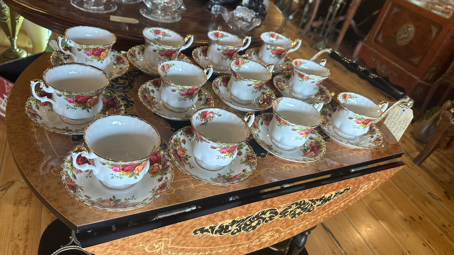 Teacup and saucer set in Prince Albert's “Old Country Roses” pattern trimmed in 22k gold