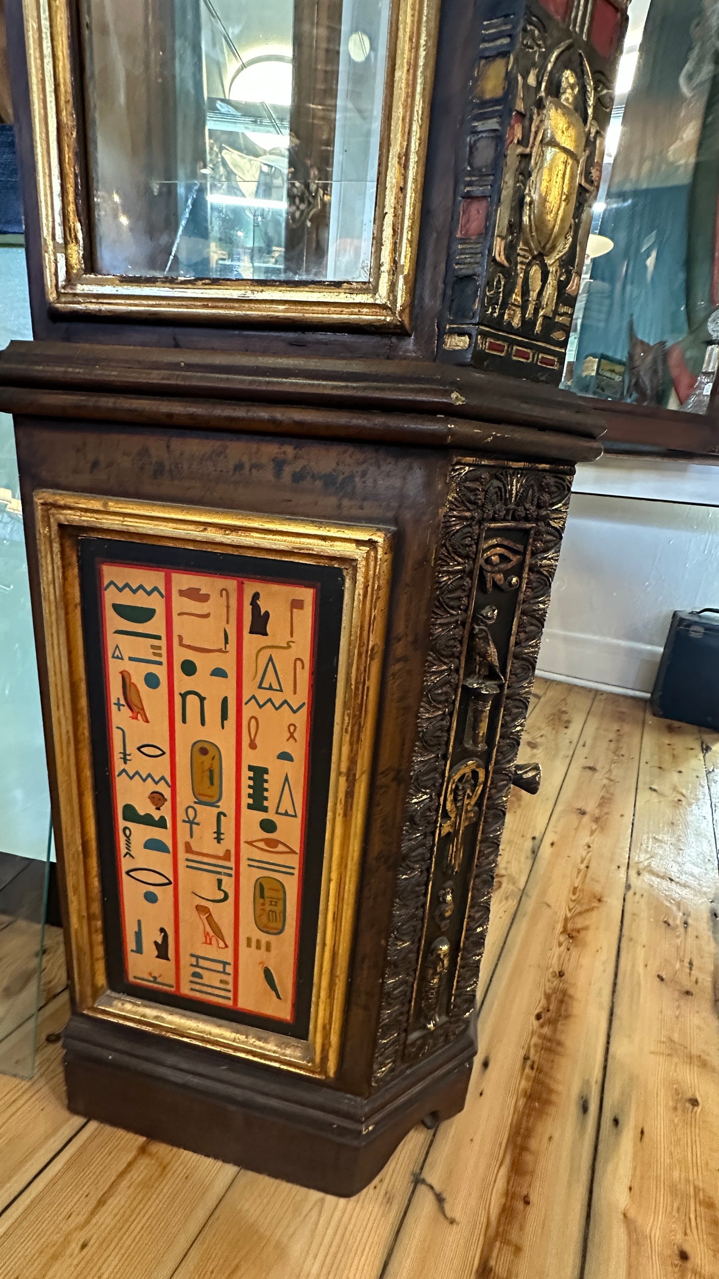 Egyptian Sarcophagus style display cabinet, with glass shelves and interior lighting
