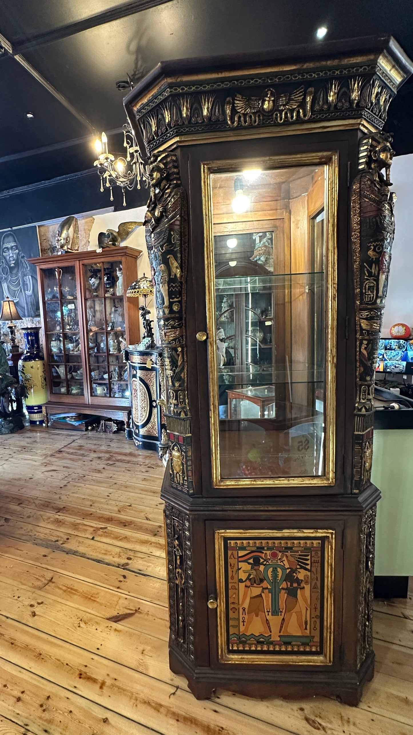 Egyptian Sarcophagus style display cabinet, with glass shelves and interior lighting