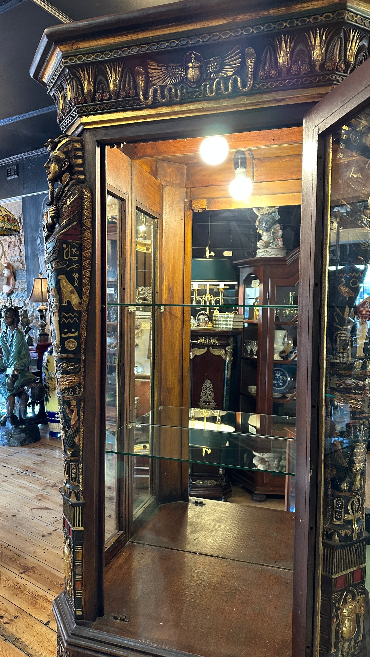 Egyptian Sarcophagus style display cabinet, with glass shelves and interior lighting