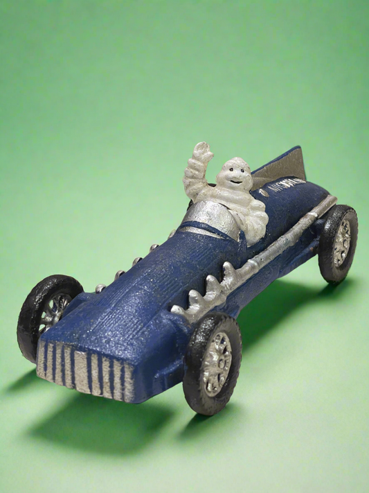 Michelin Man Racing Car Cast Iron Figure