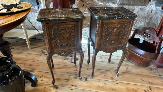 Antique 19th-century French Louis XV style walnut side table with a black marble top and intricate Rococo carving, with two drawers