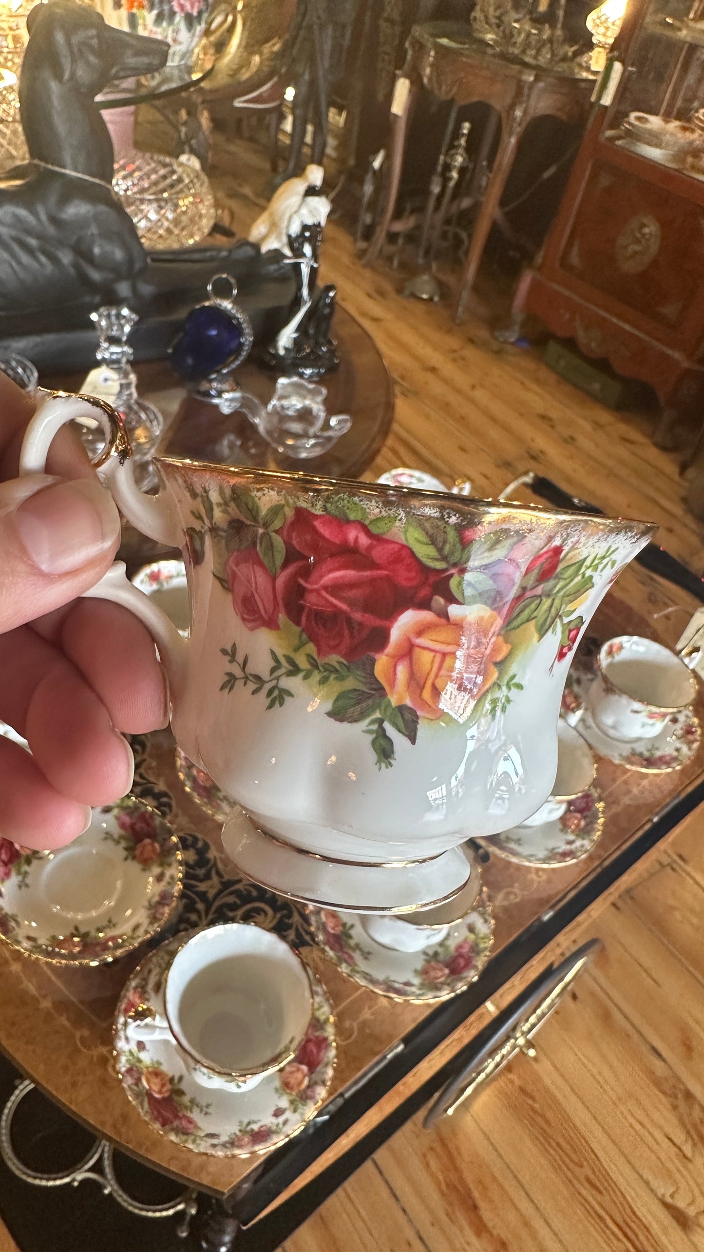 Teacup and saucer set in Prince Albert's “Old Country Roses” pattern trimmed in 22k gold