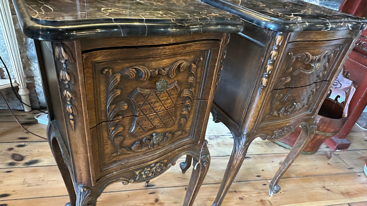 Antique 19th-century French Louis XV style walnut side table with a black marble top and intricate Rococo carving, with two drawers