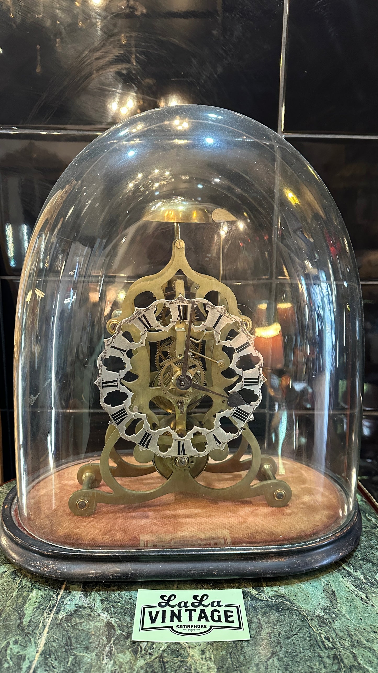 Antique Skeleton Clock incased in blown glass dome