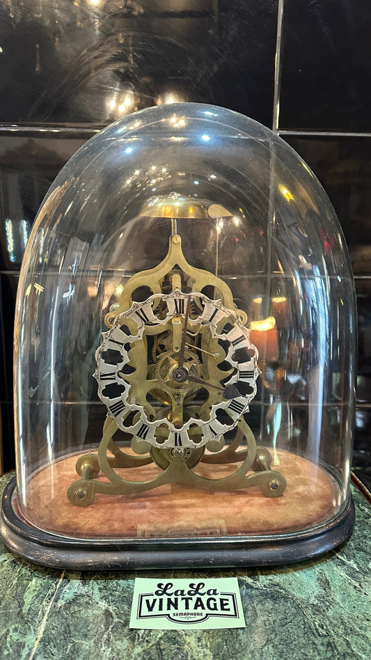 Antique Skeleton Clock incased in blown glass dome