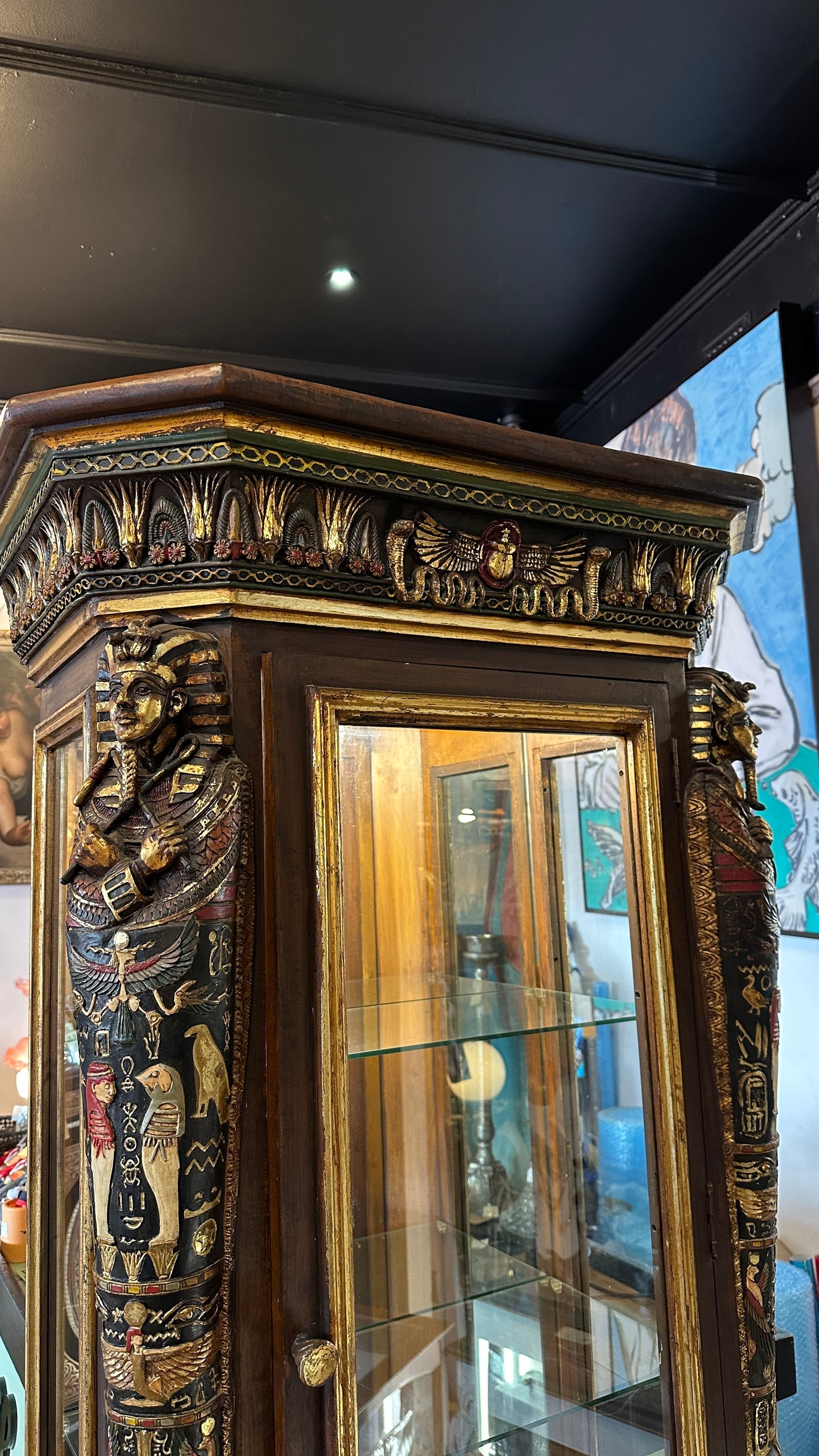 Egyptian Sarcophagus style display cabinet, with glass shelves and interior lighting