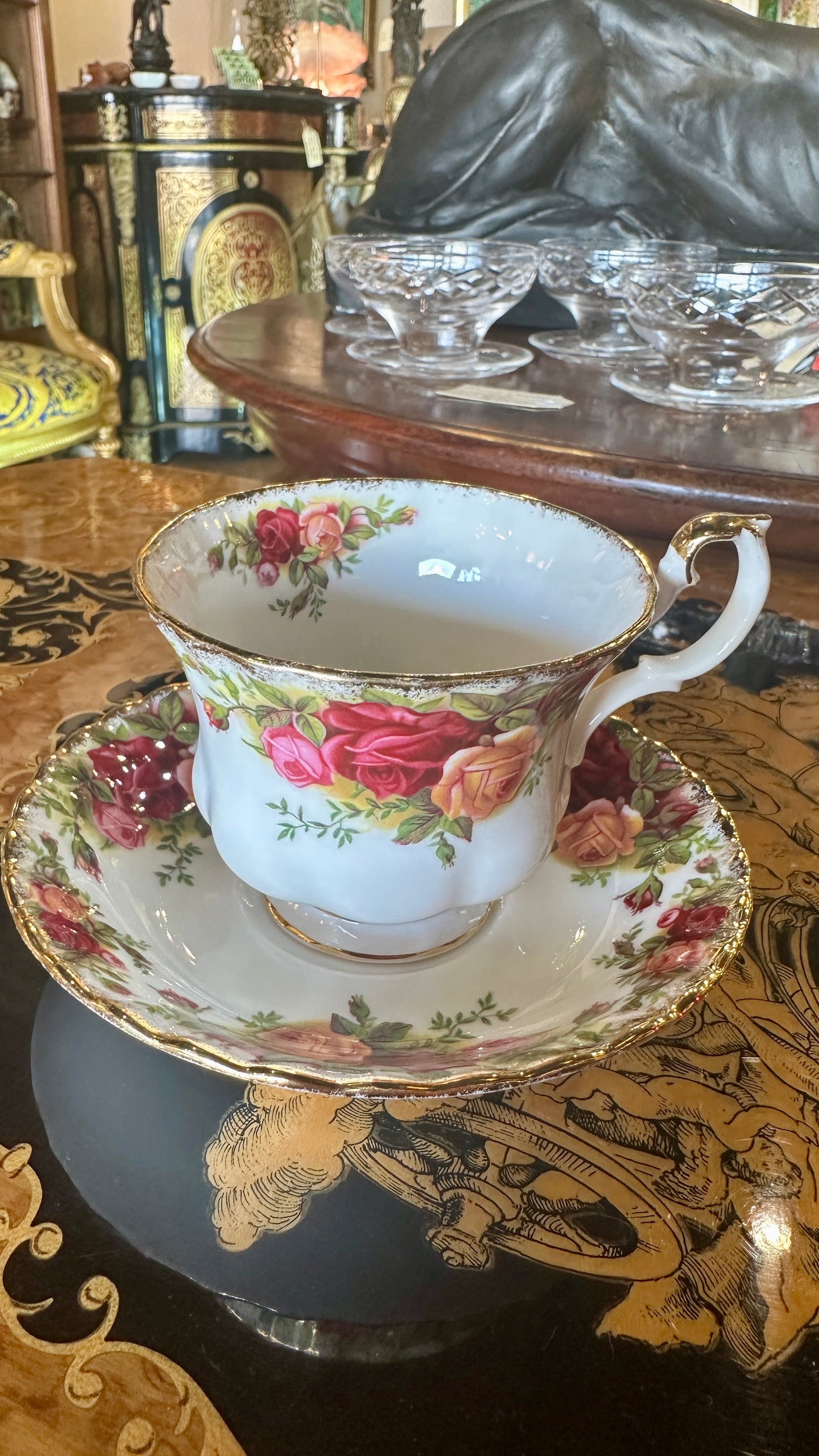 Teacup and saucer set in Prince Albert's “Old Country Roses” pattern trimmed in 22k gold