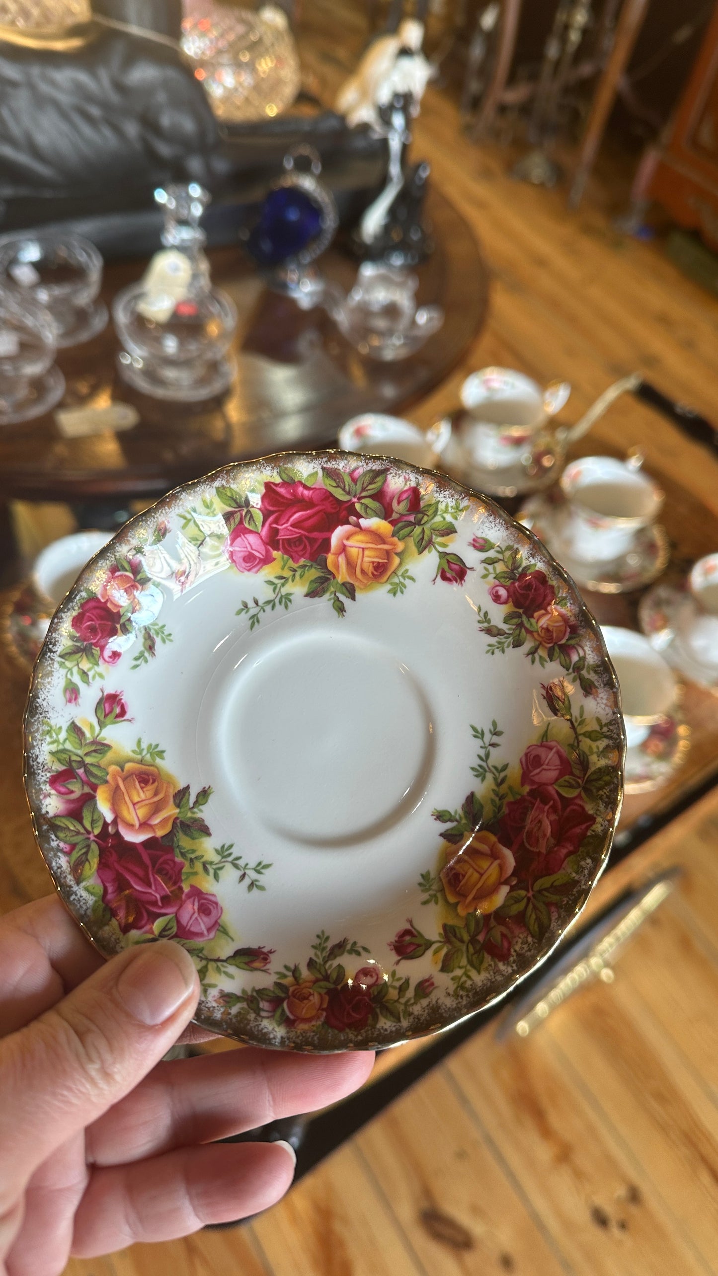 Teacup and saucer set in Prince Albert's “Old Country Roses” pattern trimmed in 22k gold