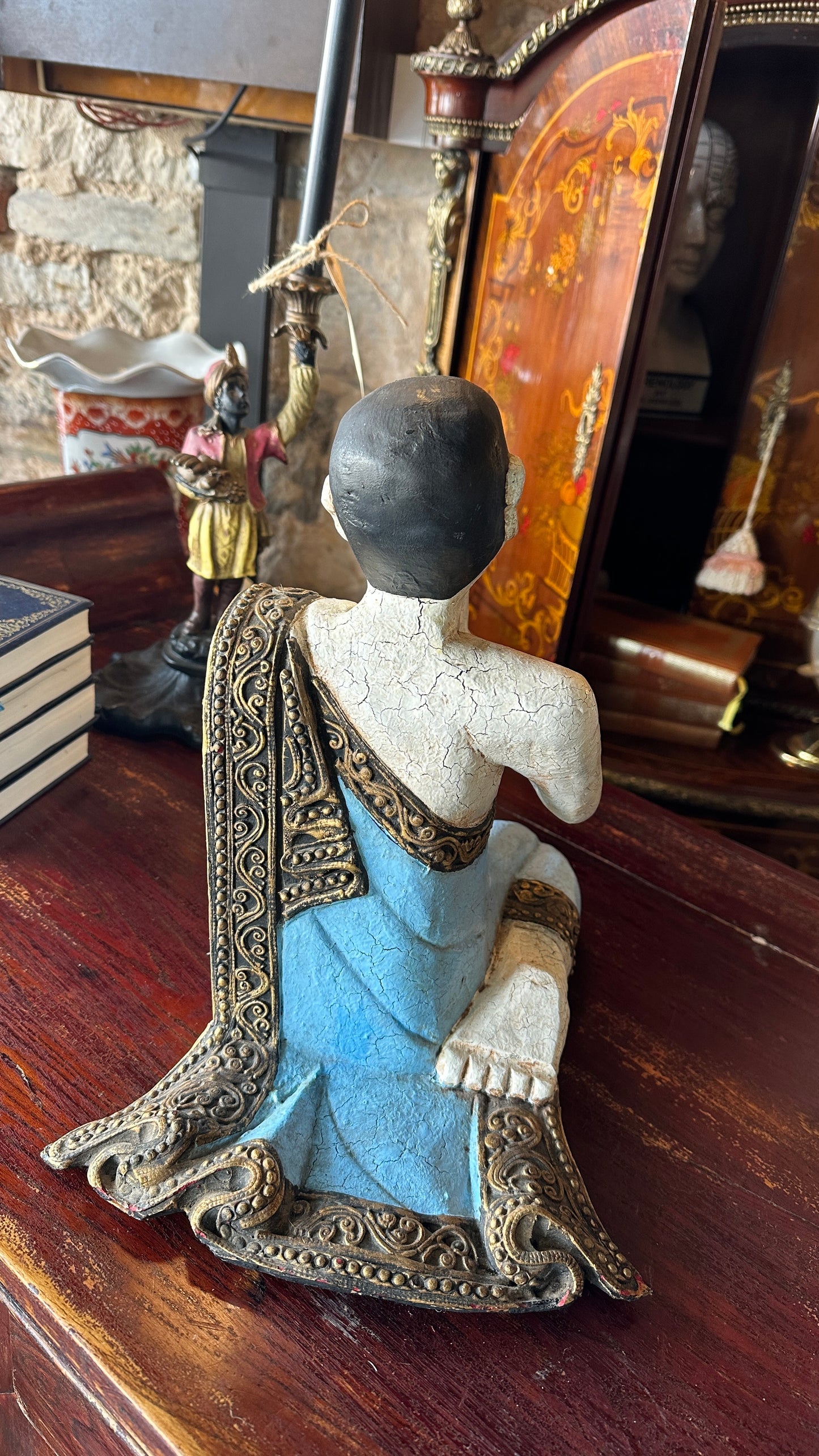 Vintage carved wooden sculpture of a praying monk