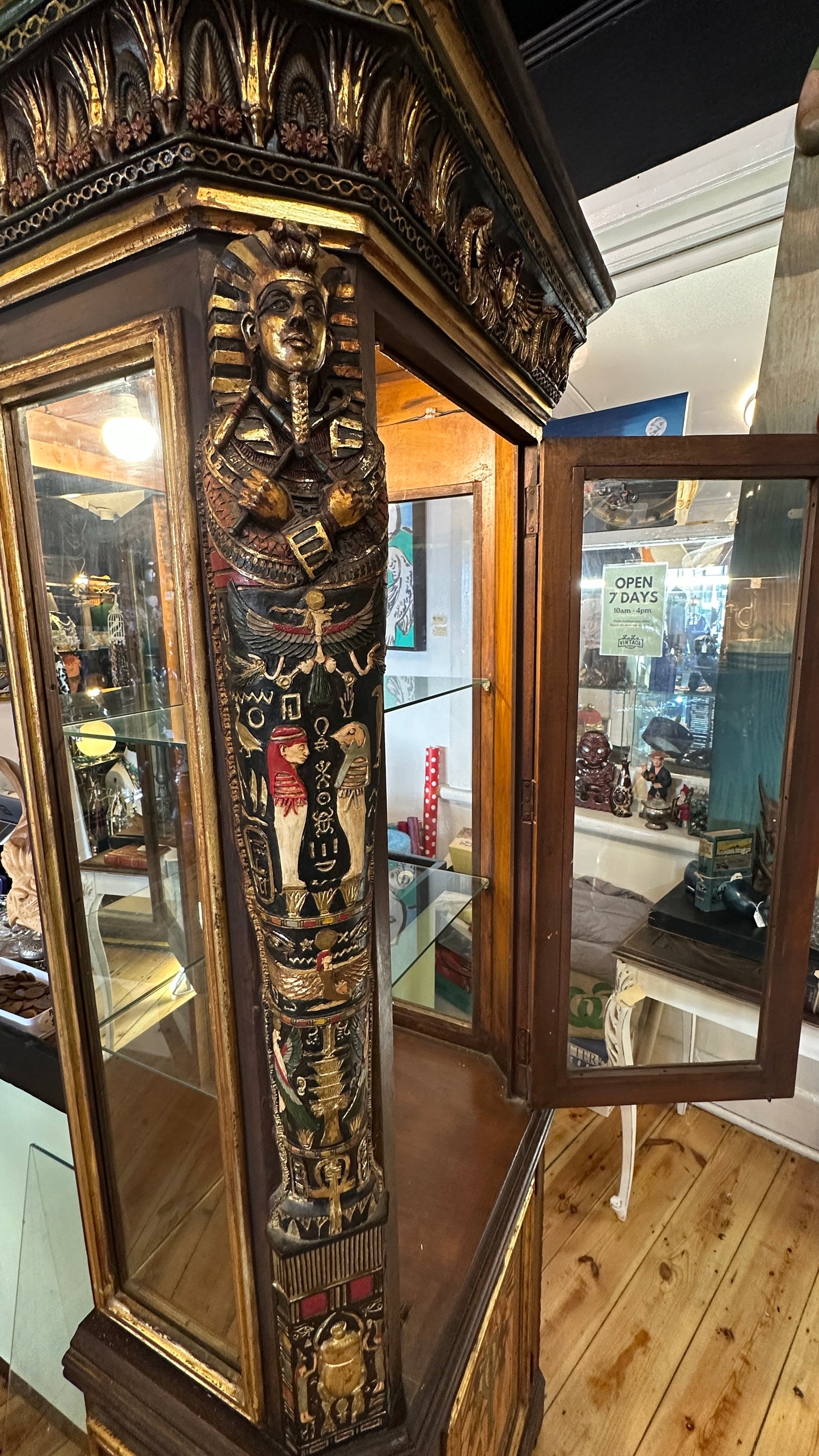 Egyptian Sarcophagus style display cabinet, with glass shelves and interior lighting