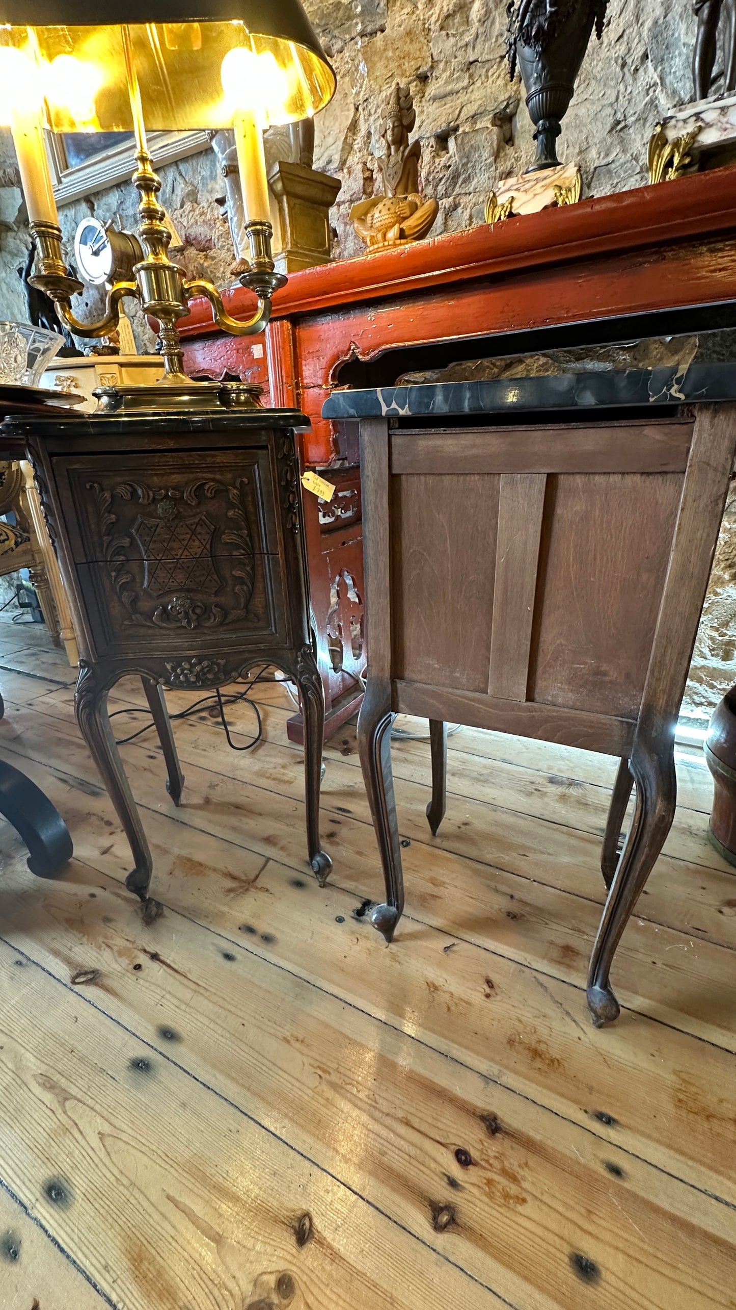 Antique 19th-century French Louis XV style walnut side table with a black marble top and intricate Rococo carving, with two drawers
