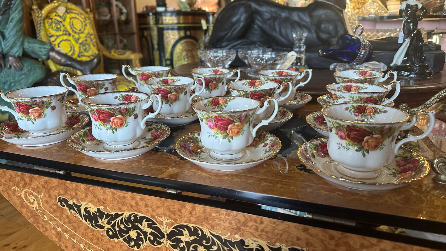 Teacup and saucer set in Prince Albert's “Old Country Roses” pattern trimmed in 22k gold