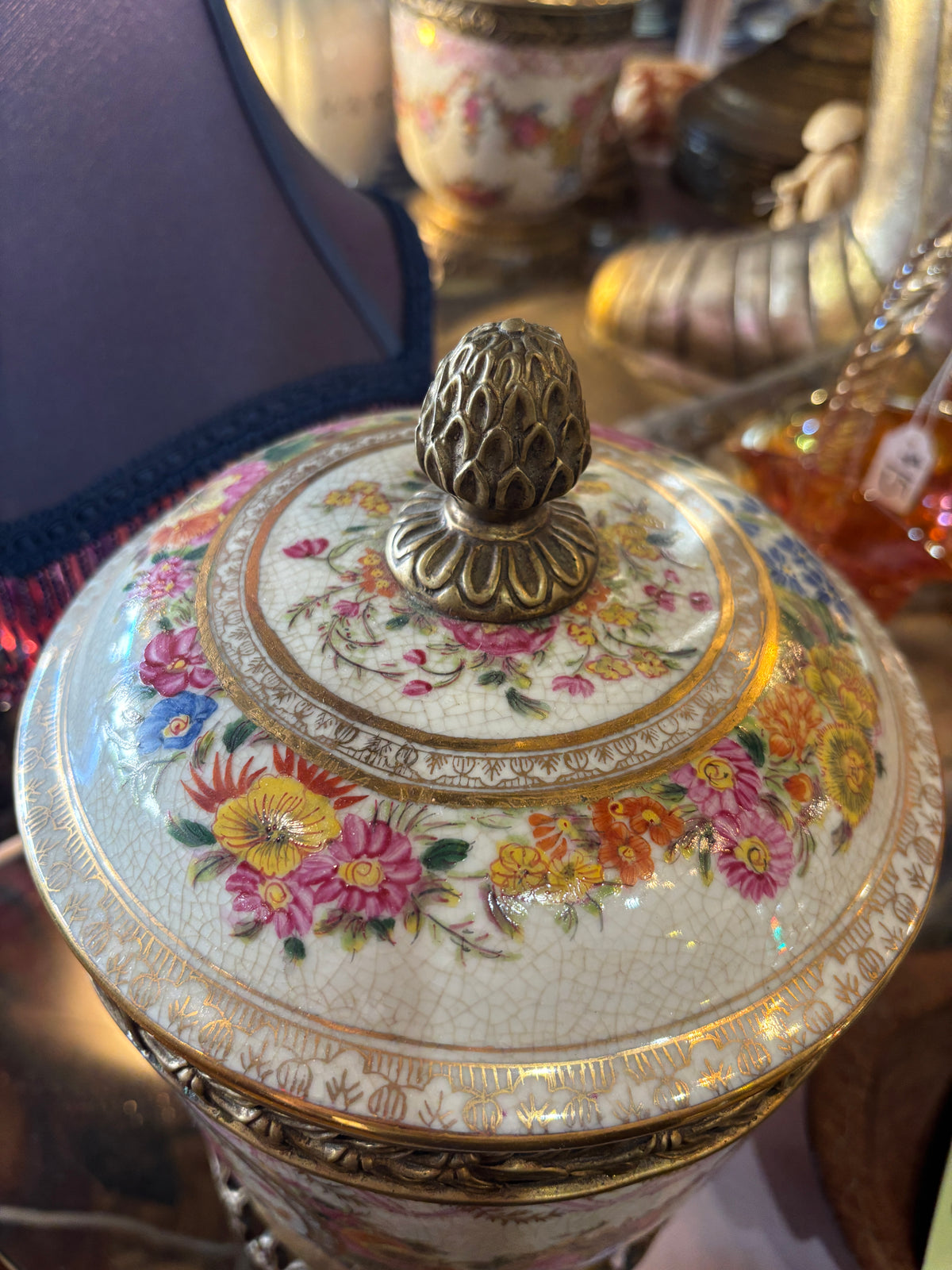 Beautiful Ceramic Pot/Urn with Brass Stand and Extensive Floral Decoration